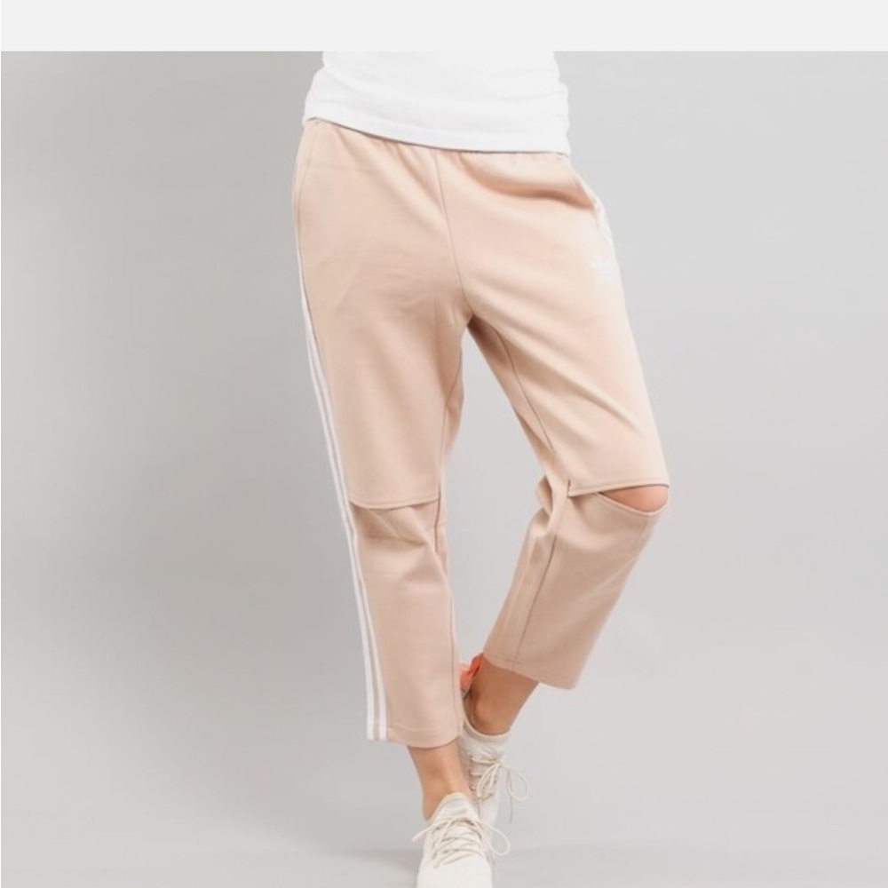 Adidas Pink Track Pants with White Accents and Open Knees